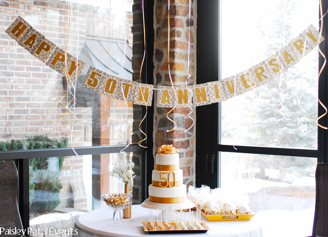 50th wedding anniversary table with banner